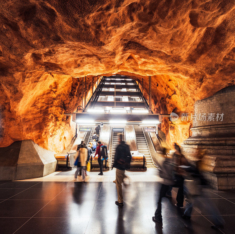 People using subway station escalator - Rådhuset in Stockholm